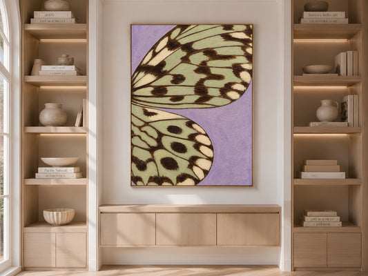 Lavender sage green butterfly wing print framed on built-in shelving in a neutral living room