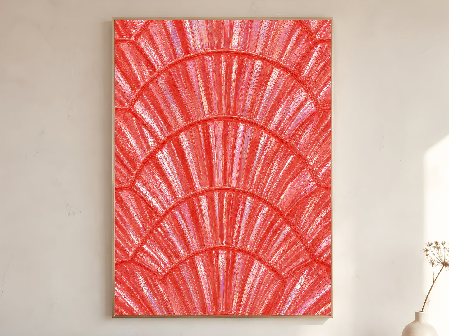 Coral iridescent capiz shell print in gold frame leaning against a white wall with dried florals