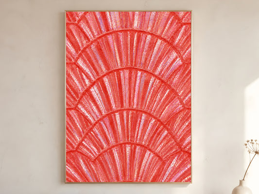 Coral iridescent capiz shell print in gold frame leaning against a white wall with dried florals