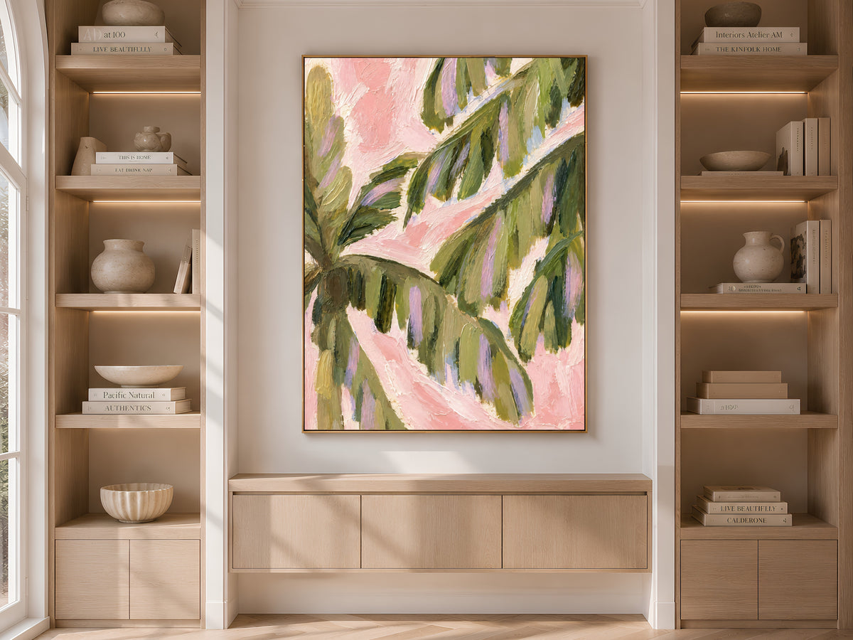 Preppy palm leaf print displayed between styled bookshelves