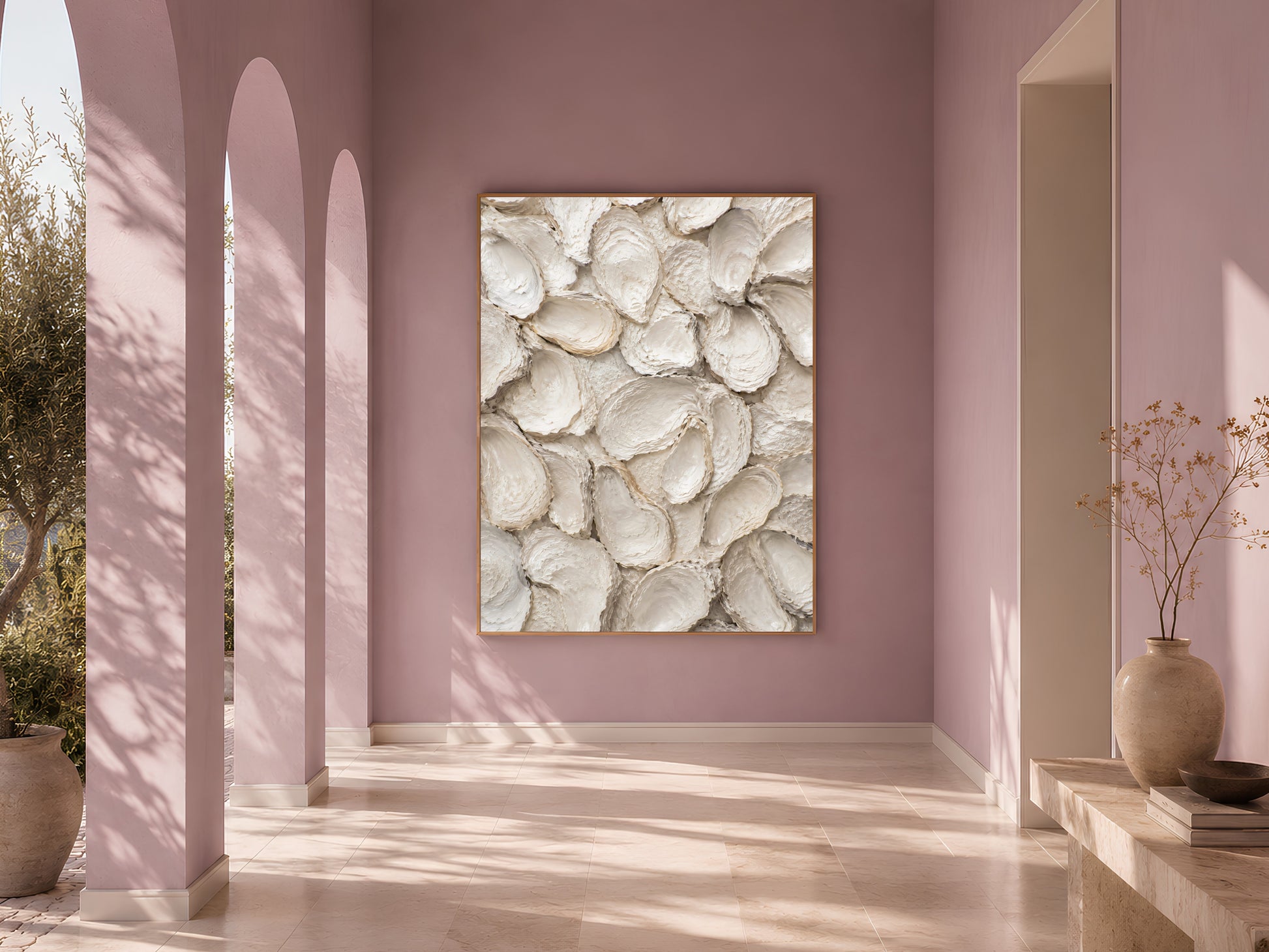 Sunlit arched hallway with dusty mauve walls and a framed whitewashed oyster shell print as a statement piece.