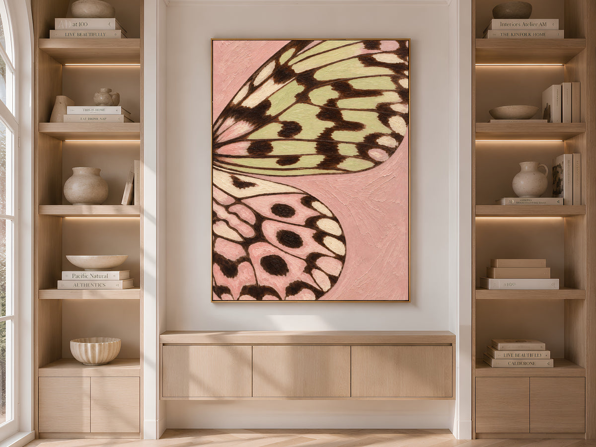 Butterfly wing print framed and displayed on built-in shelving in a neutral living room