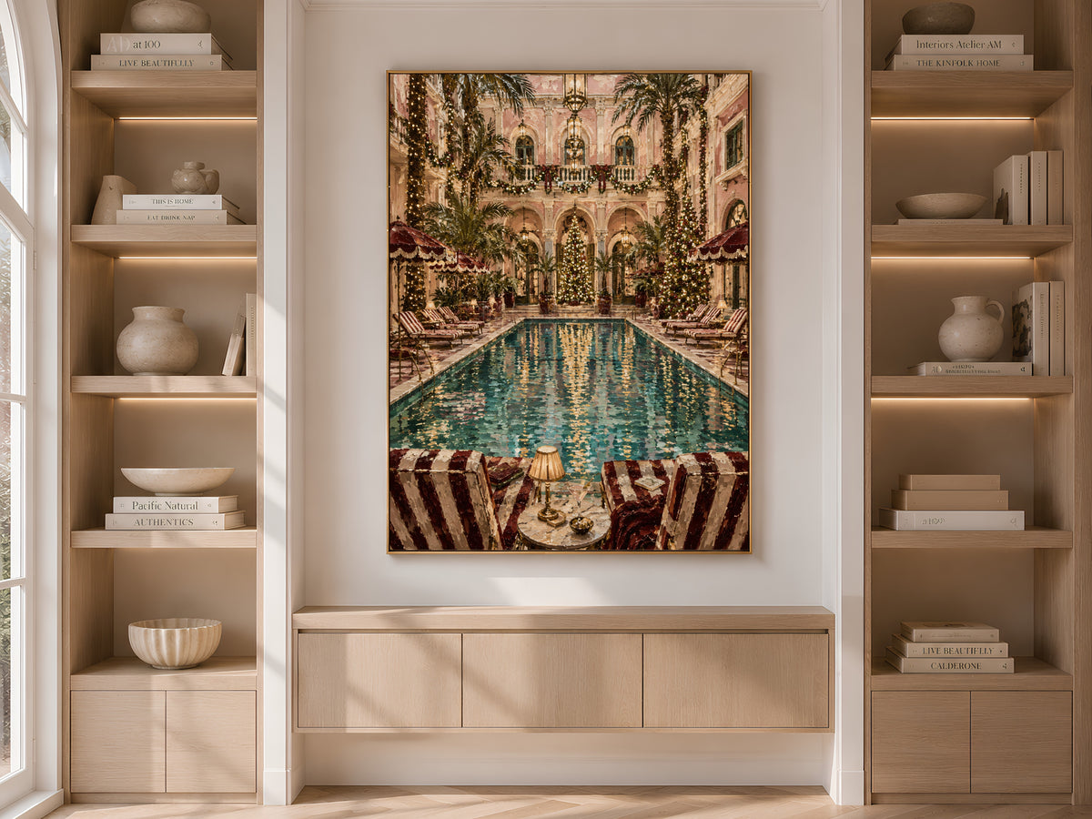 Grand hotel Christmas wall art framed on built-in bookshelves styled with books and vases