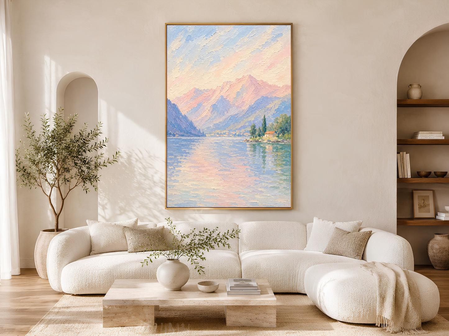 Italian lake painting framed above a cream sofa in a sunlit living room.
