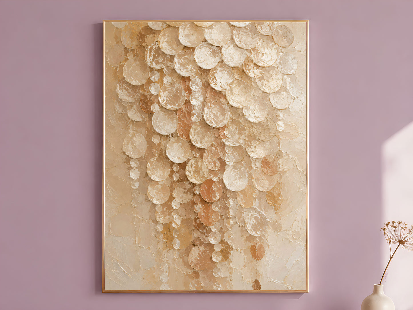 Cream capiz shell wall art in gold frame on mauve wall with dried flowers
