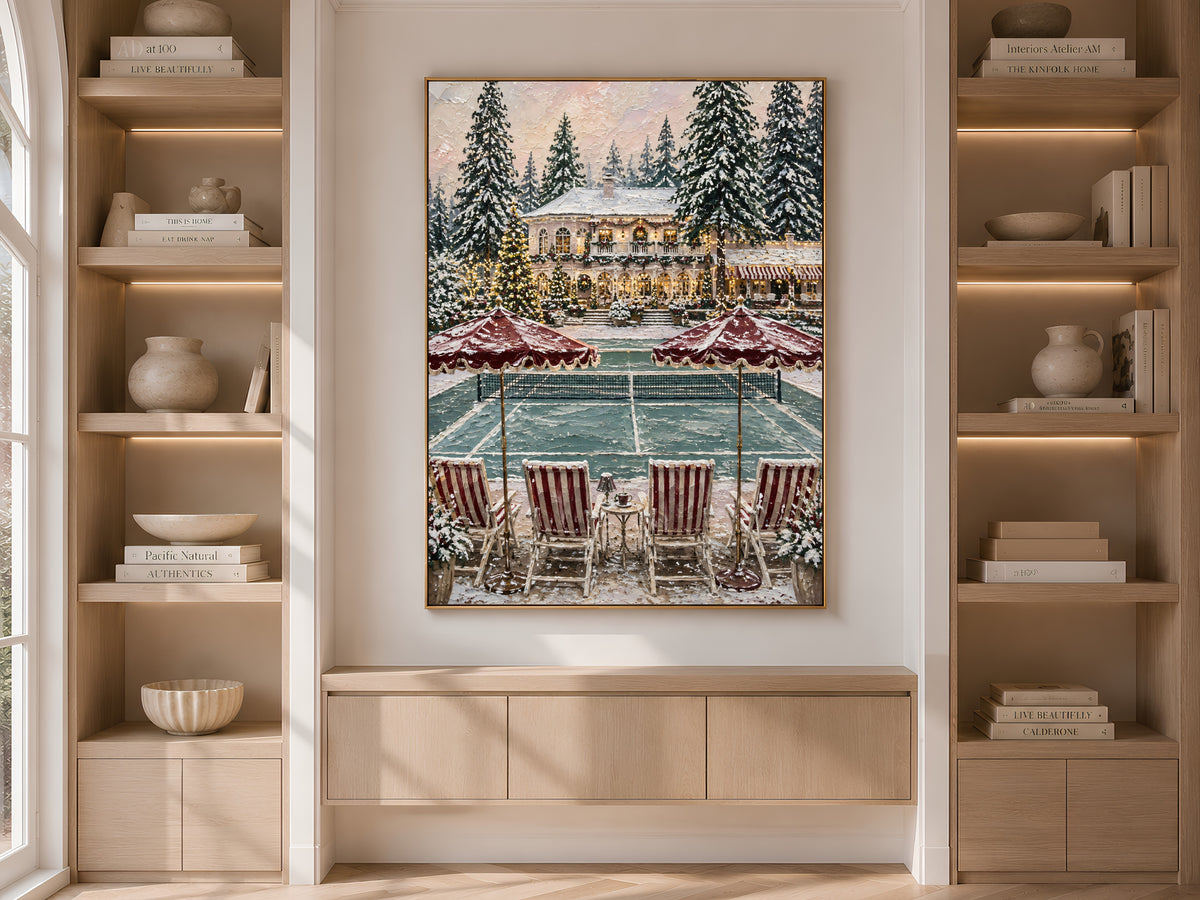 Old money Christmas wall art framed and displayed on a built-in bookshelf styled with books and vases