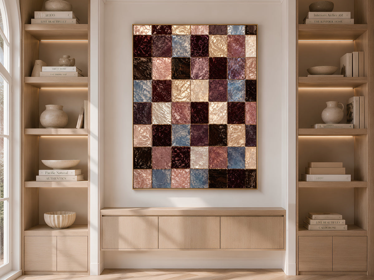 Checkerboard mosaic print framed on built-in bookshelves styled with books and vases