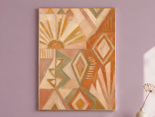 Boho geometric wall art print framed on a mauve wall, terracotta sunburst and sage diamond pattern impasto oil painting style, with a small vase of dried flowers
