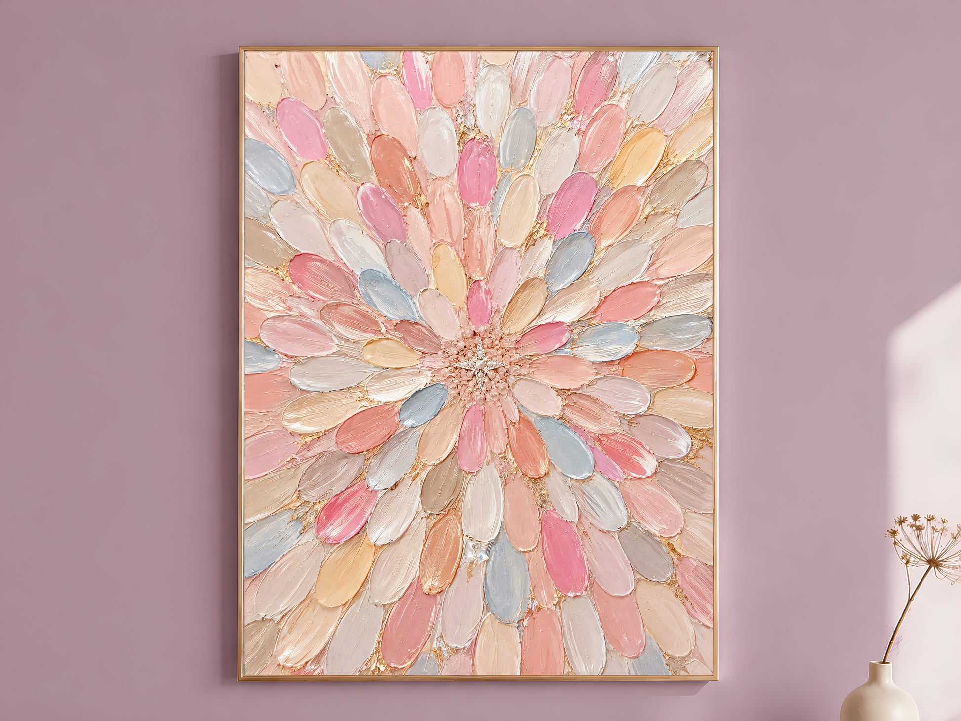 Pastel dahlia wall art in a gold frame on a dusty mauve wall, styled with a dried flower stem.

