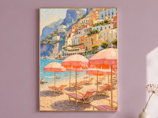 Framed Positano beach umbrellas wall art print in a thin gold frame, hanging on a dusty mauve wall above a wooden bench with a dried flower stem.
