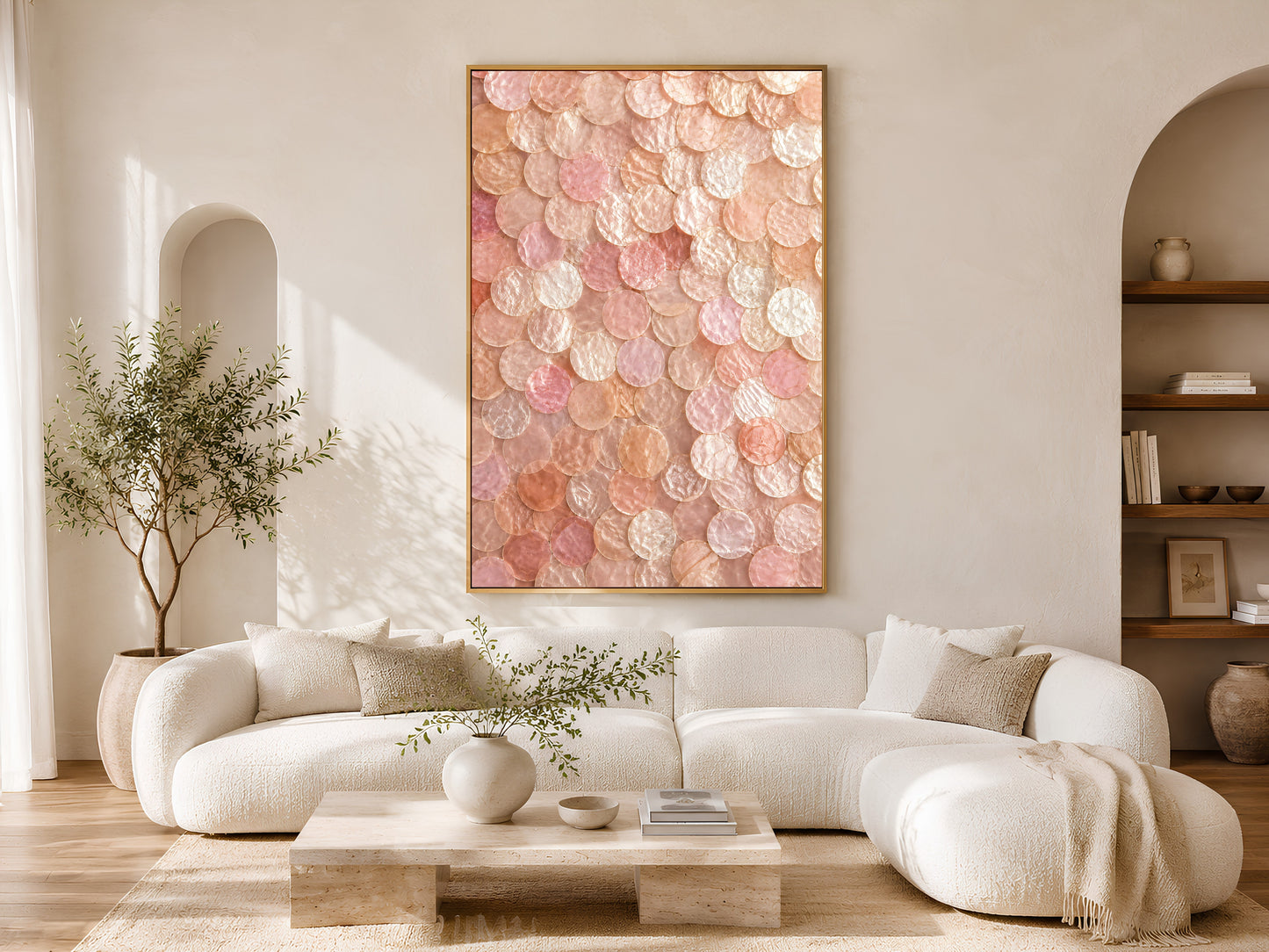 Pink coastal shell wall art printable displayed above a curved cream sofa in a luxury coastal living room with warm neutral decor.