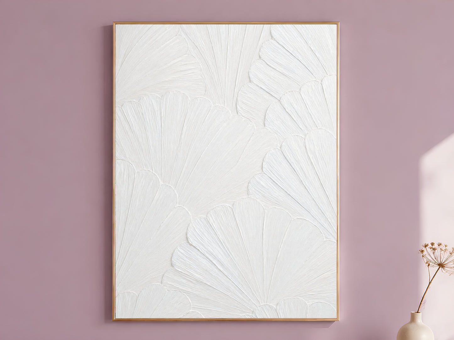 White plaster scallop mosaic print in a thin gold frame against a mauve wall with dried flowers, wabi sabi wall art
