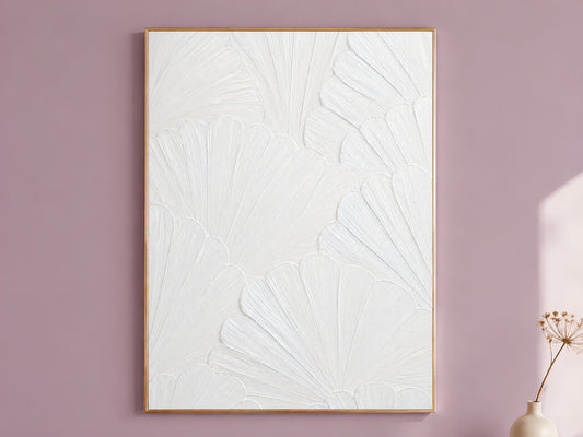White plaster scallop mosaic print in a thin gold frame against a mauve wall with dried flowers, wabi sabi wall art
