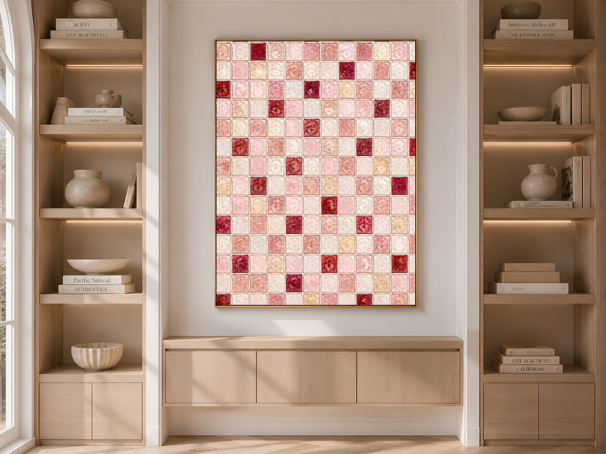 Dusty rose mosaic wall art framed on a built-in bookshelf with books and decor