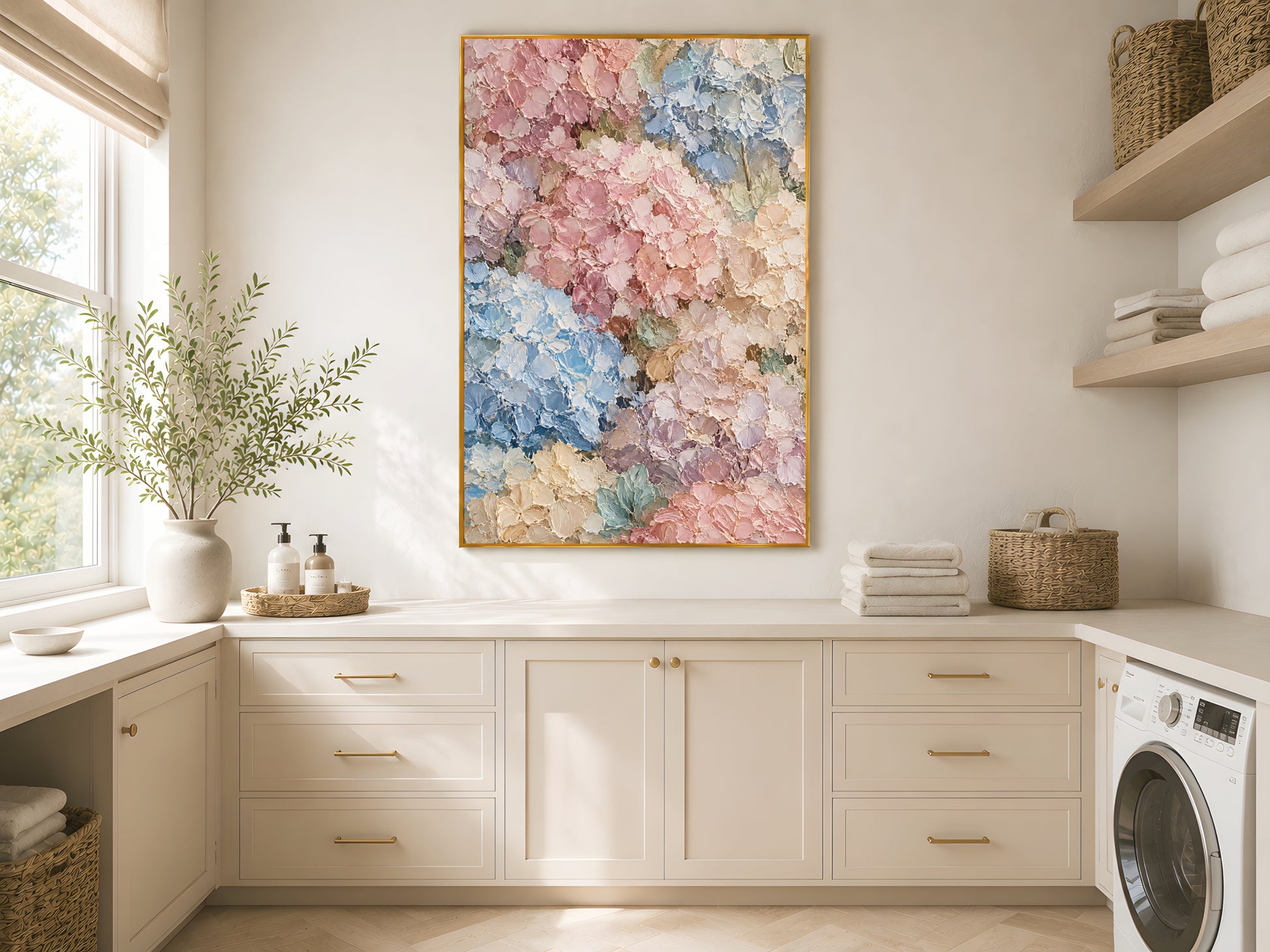 Pastel hydrangea wall art print in a gold frame above white kitchen cabinets in a clean Scandinavian kitchen with dried botanicals
