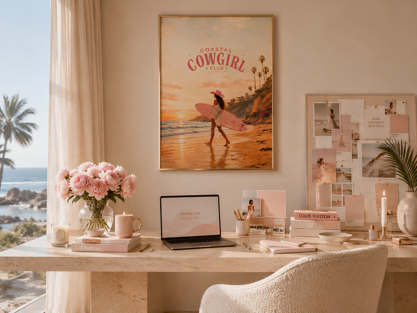 Coastal Cowgirl print in a gold frame on a sunlit desk with a laptop, pink roses, and coastal feminine workspace styling
