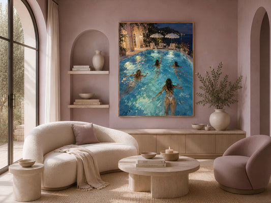 Night swim pool print framed on a wall beside a cream sofa and round chairs