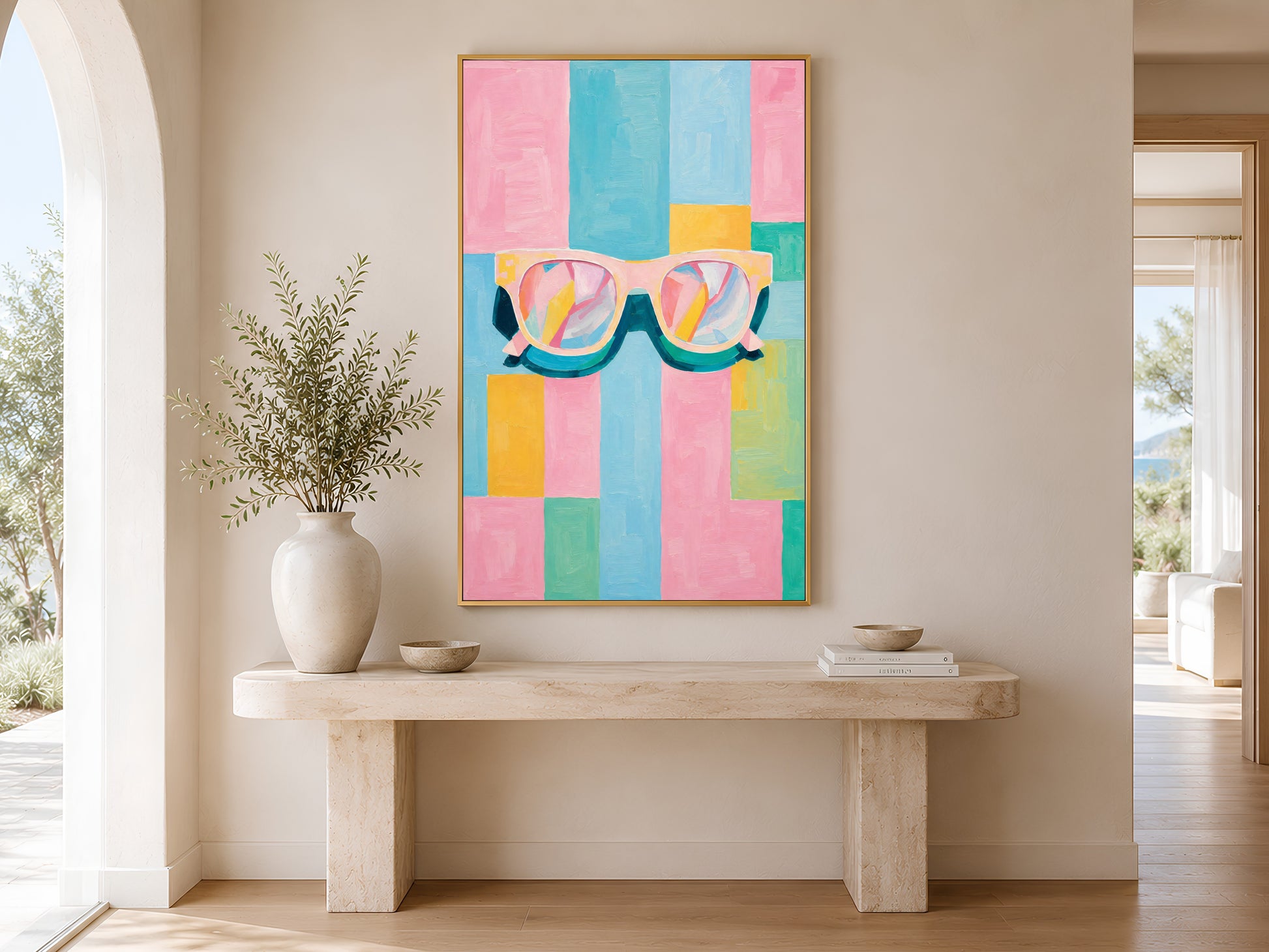 Framed impasto retro sunglasses print on warm white wall in minimal entryway with wooden console table and tall white vases
