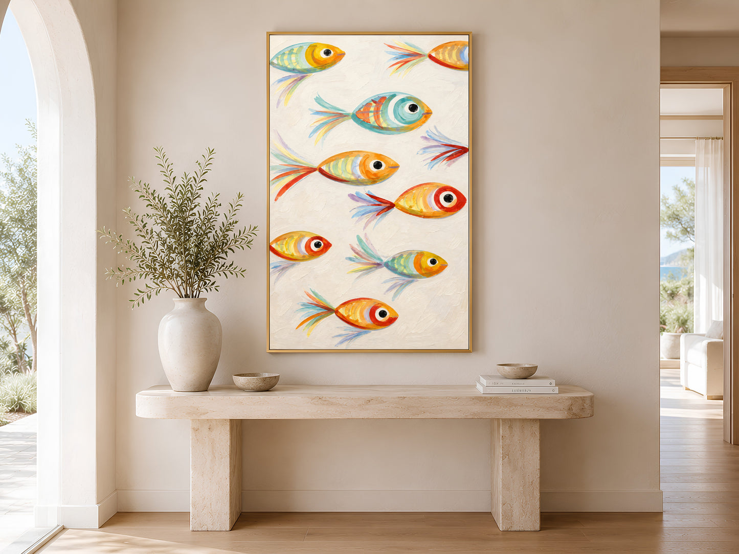 Framed impasto whimsical fish wall art on warm white wall in minimal entryway with wooden console table and tall white vases

