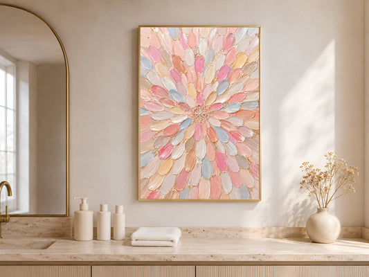 Pastel dahlia wall art above a wood counter styled with towels and a small vase of flowers.
