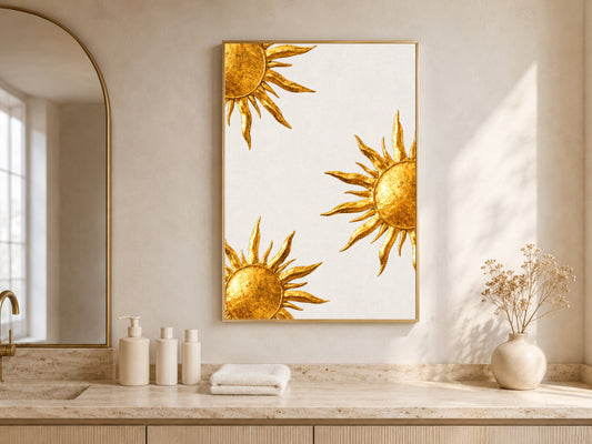 Gold sunburst wall art framed above a vanity in a neutral boho bathroom with arched window