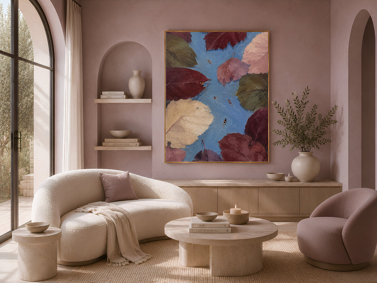Whimsical leaf and swimmer wall art framed above cream sofa in boho living room