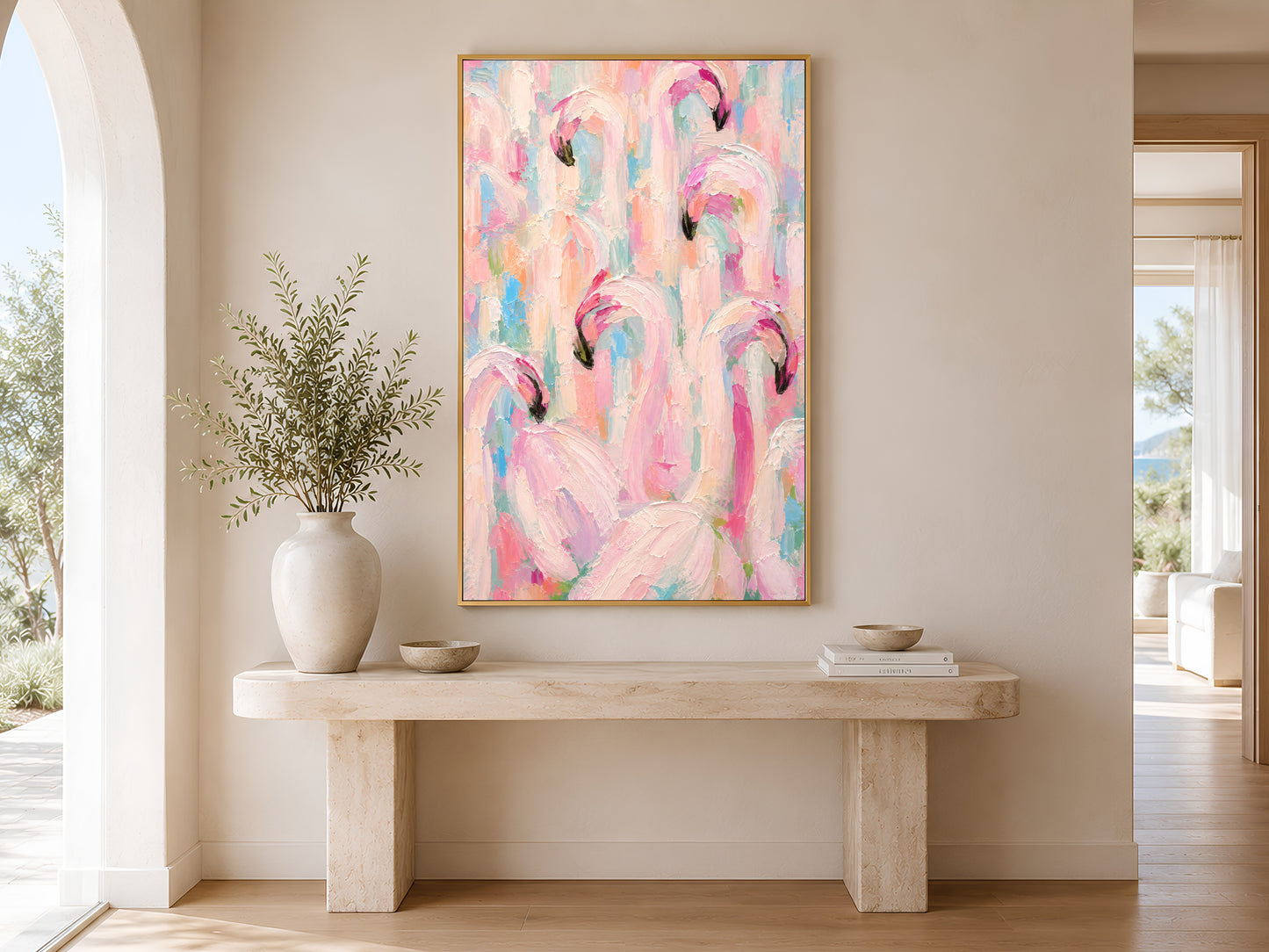 Framed impasto flamingo flock print on warm white wall in minimal living room with wooden console table and tall vase
