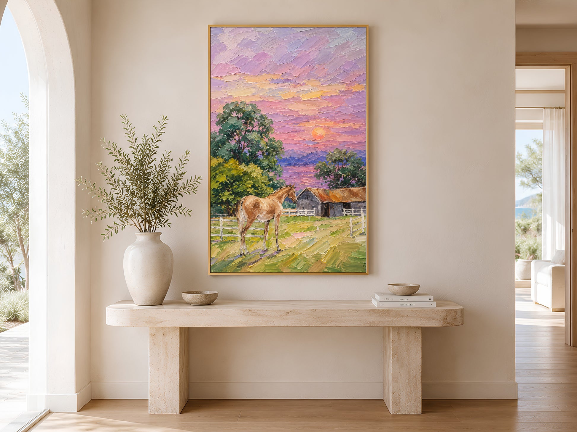 Farmhouse horse sunset impasto painting in a gold frame displayed above a warm wood console table in a bright entryway with neutral vases, botanicals, and warm natural light
