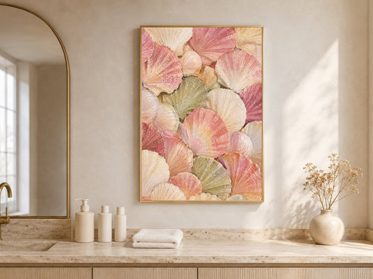 Scallop shell wall art framed above a marble bathroom counter with candles, coastal grandmother painting for bathroom decor
