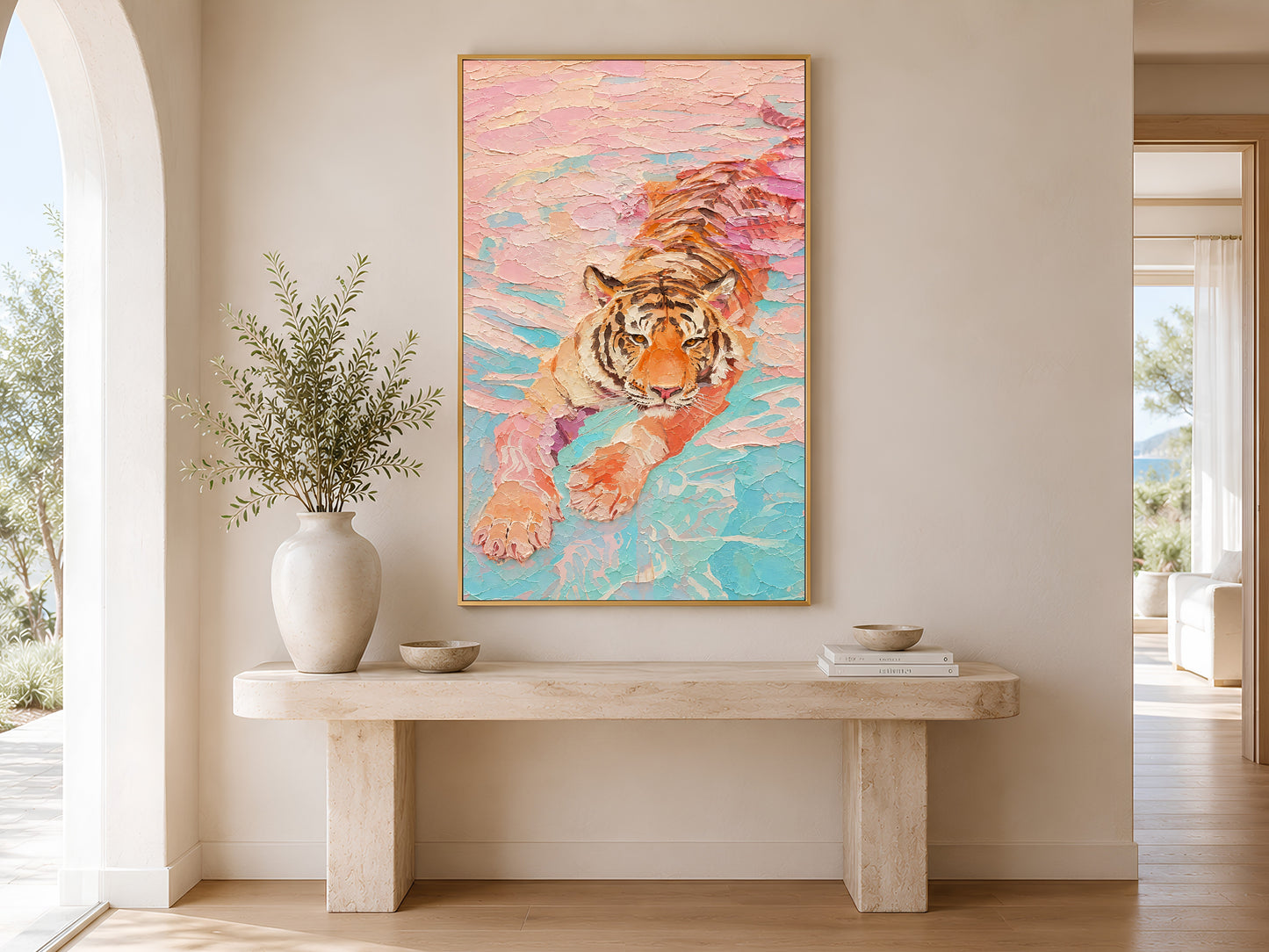 Framed pastel tiger wall art print displayed on a wall in a soft minimalist dining room with round table and linen chairs
