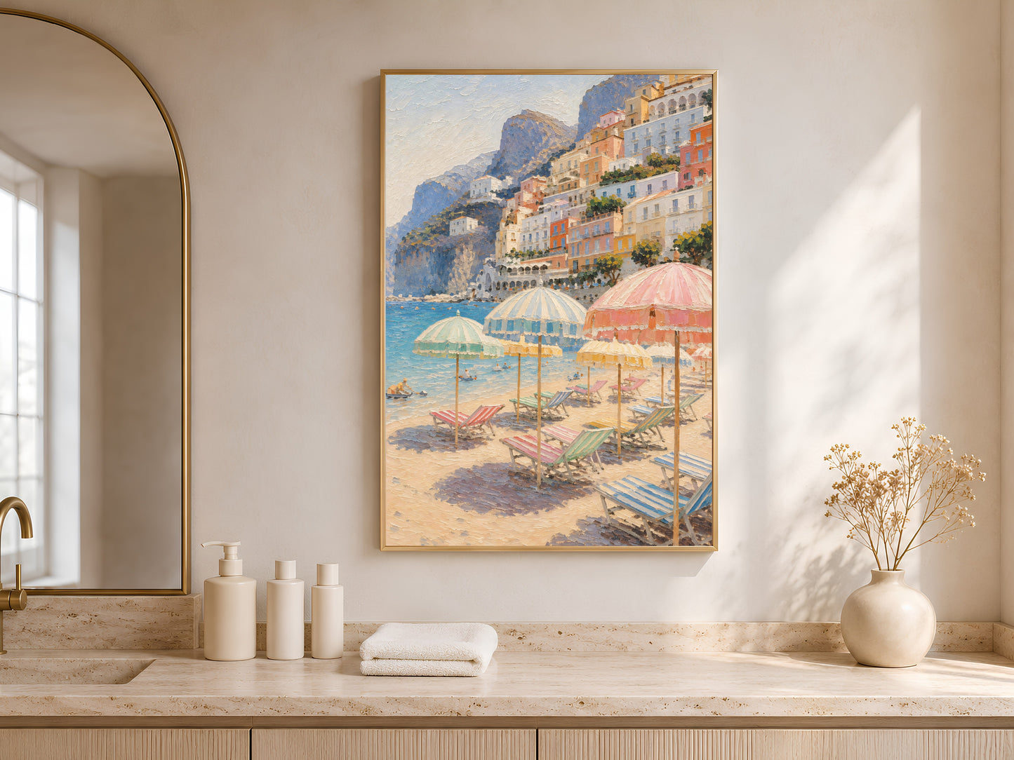 Framed Positano beach umbrellas print above a bathroom vanity with white bottles