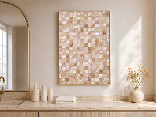 Framed iridescent mosaic tile print above a wood kitchen countertop with towels.
