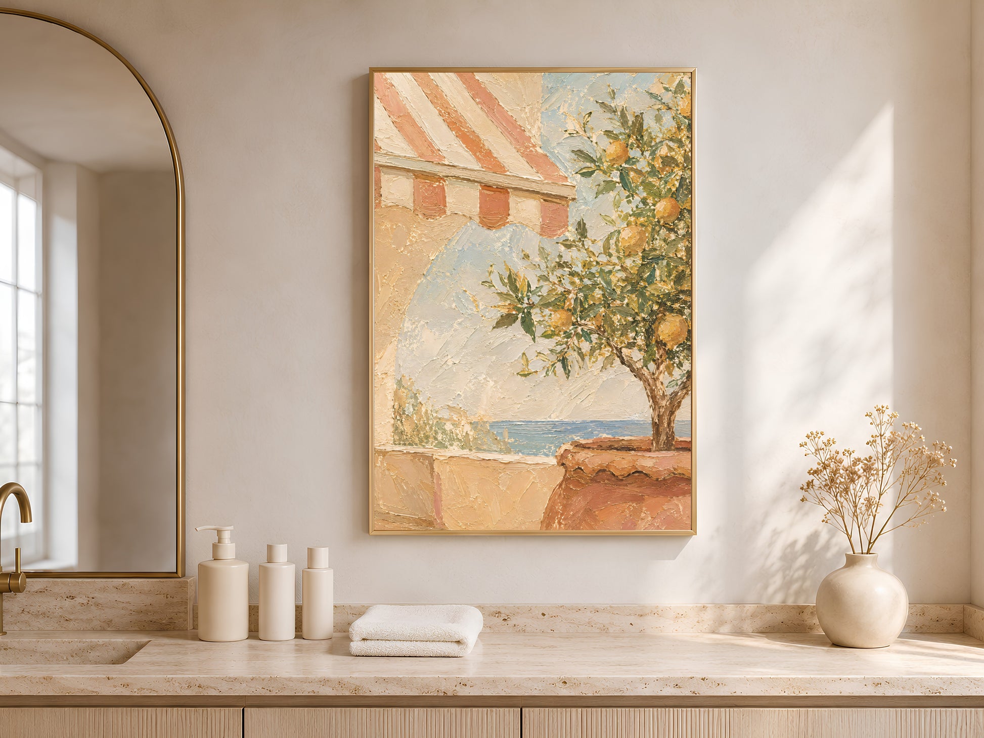 Mediterranean terrace wall art framed above a bathroom vanity counter with candles and a small vase
