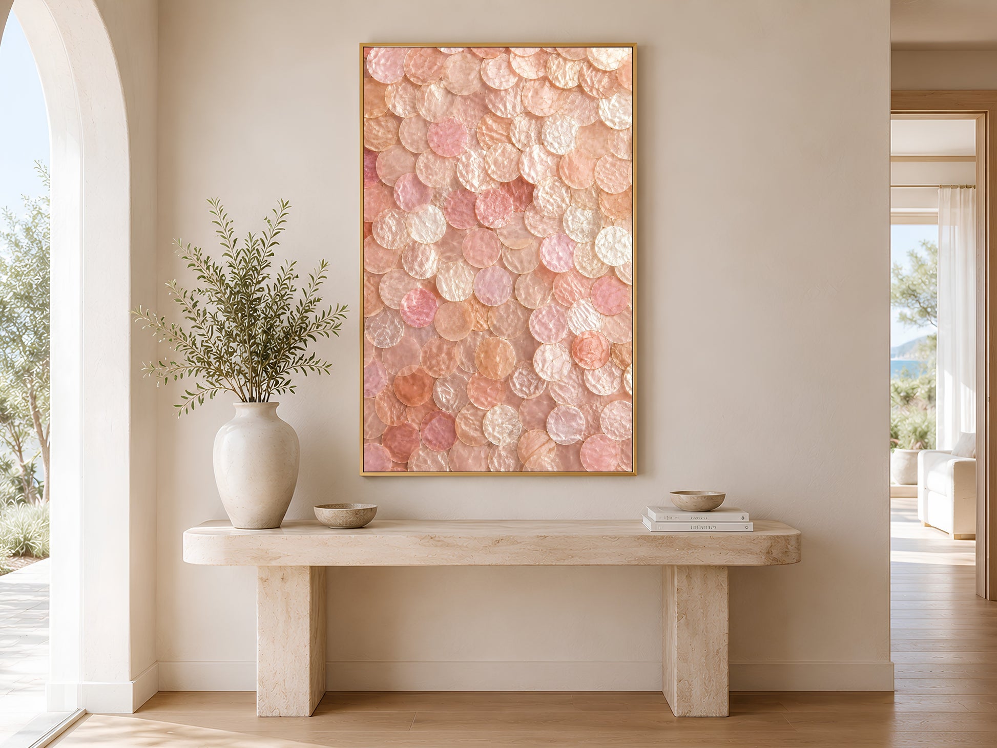 Blush capiz shell wall art printable hanging above a beige console table in a bright Mediterranean-inspired hallway with soft coastal styling.