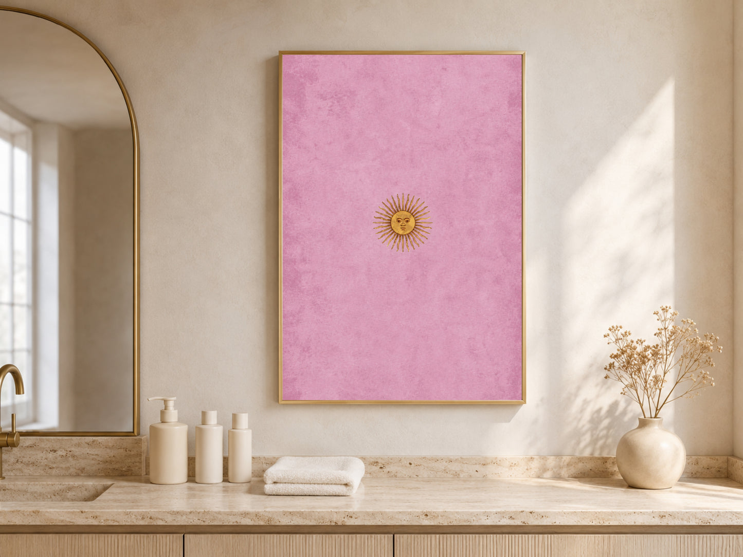 Vintage sun face wall art displayed above a vanity desk with arched shelving, celestial gallery print in gold and pink