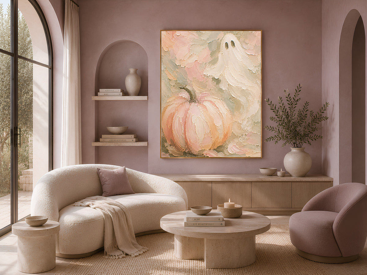 Textured pastel pumpkin wall art print displayed in an arched wall niche above a boucle sofa
