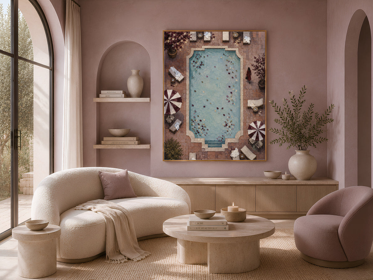 Aerial pool wall art framed above cream sofa in boho living room