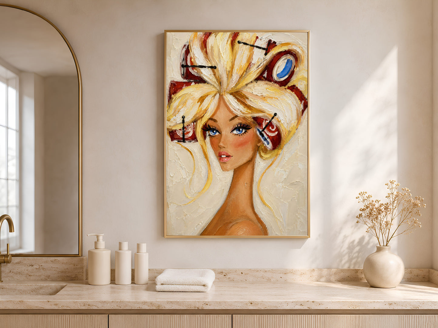 Framed retro pin-up hair rollers portrait above a wood vanity nook with a vase and towels.
