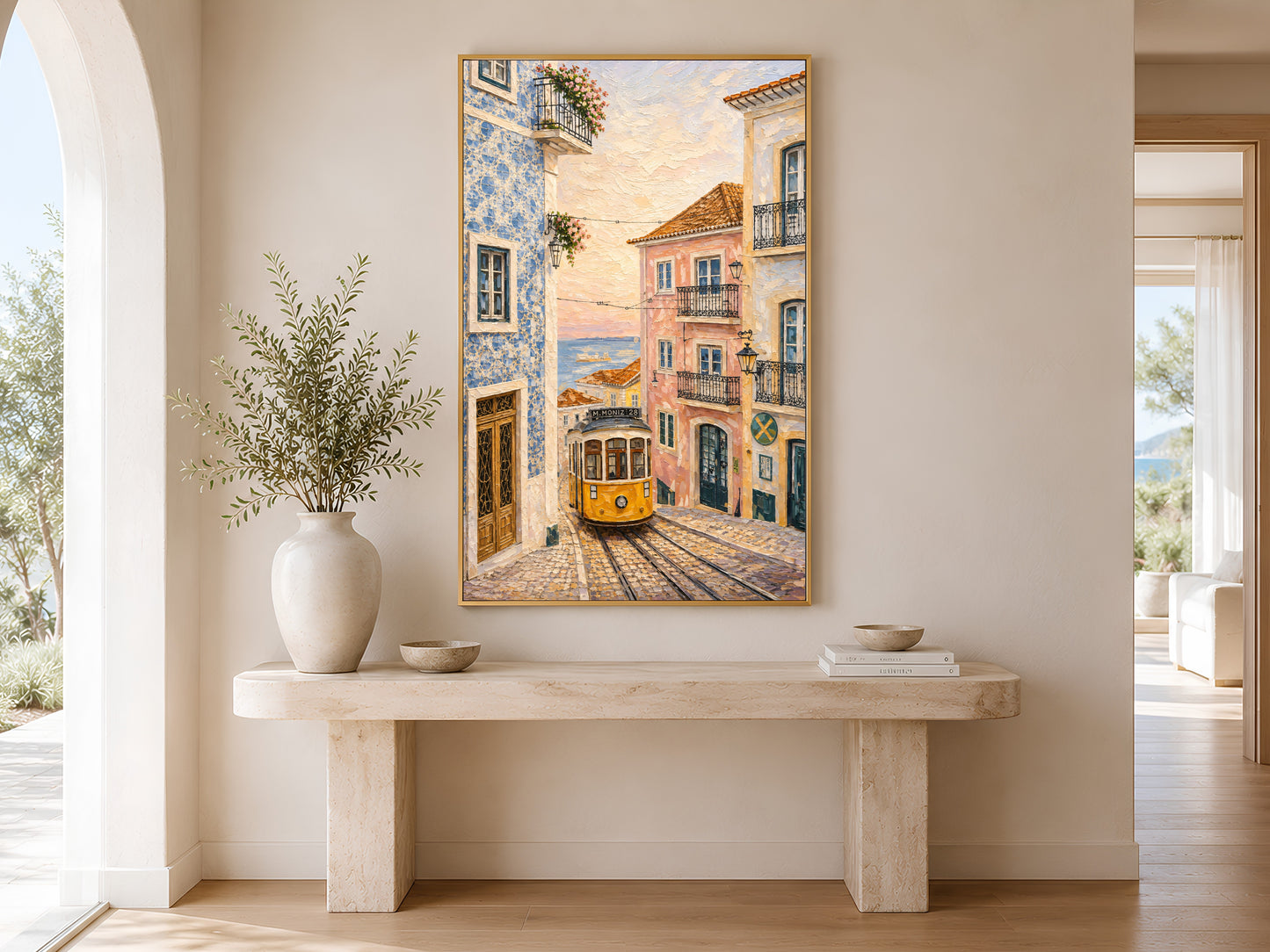 Portugal street wall art printable hanging above a beige console table in a bright Mediterranean hallway with soft neutral styling.