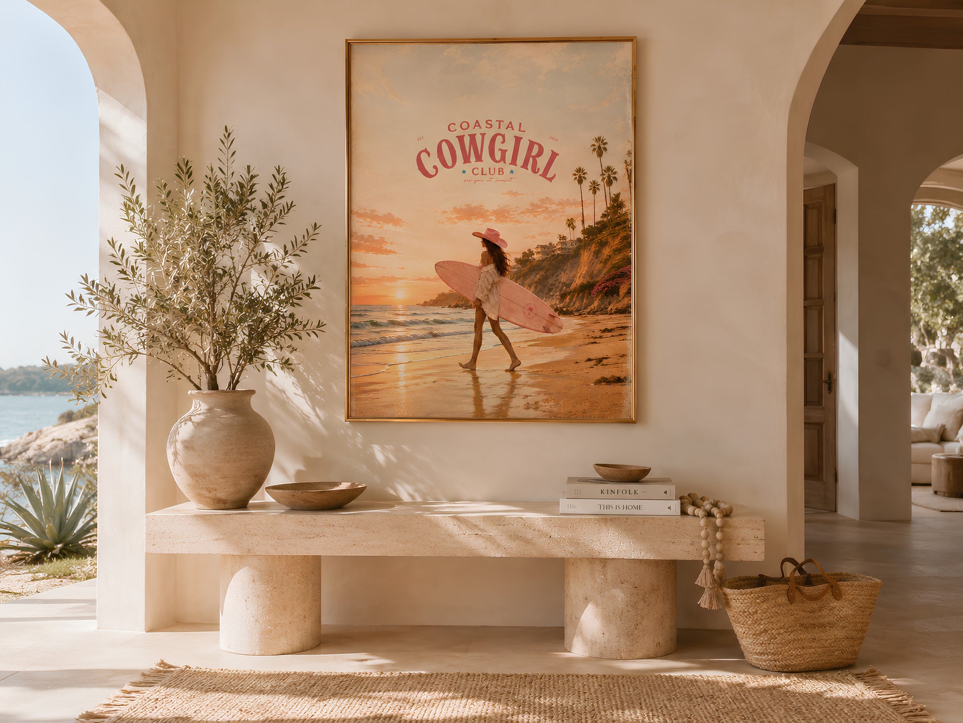 Coastal Cowgirl large format print in a bright Mediterranean-style living room with arched walls, olive tree, and linen sofa

