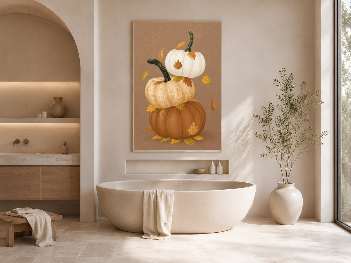 Stacked pumpkin wall art with autumn leaves in a modern soaking tub bathroom