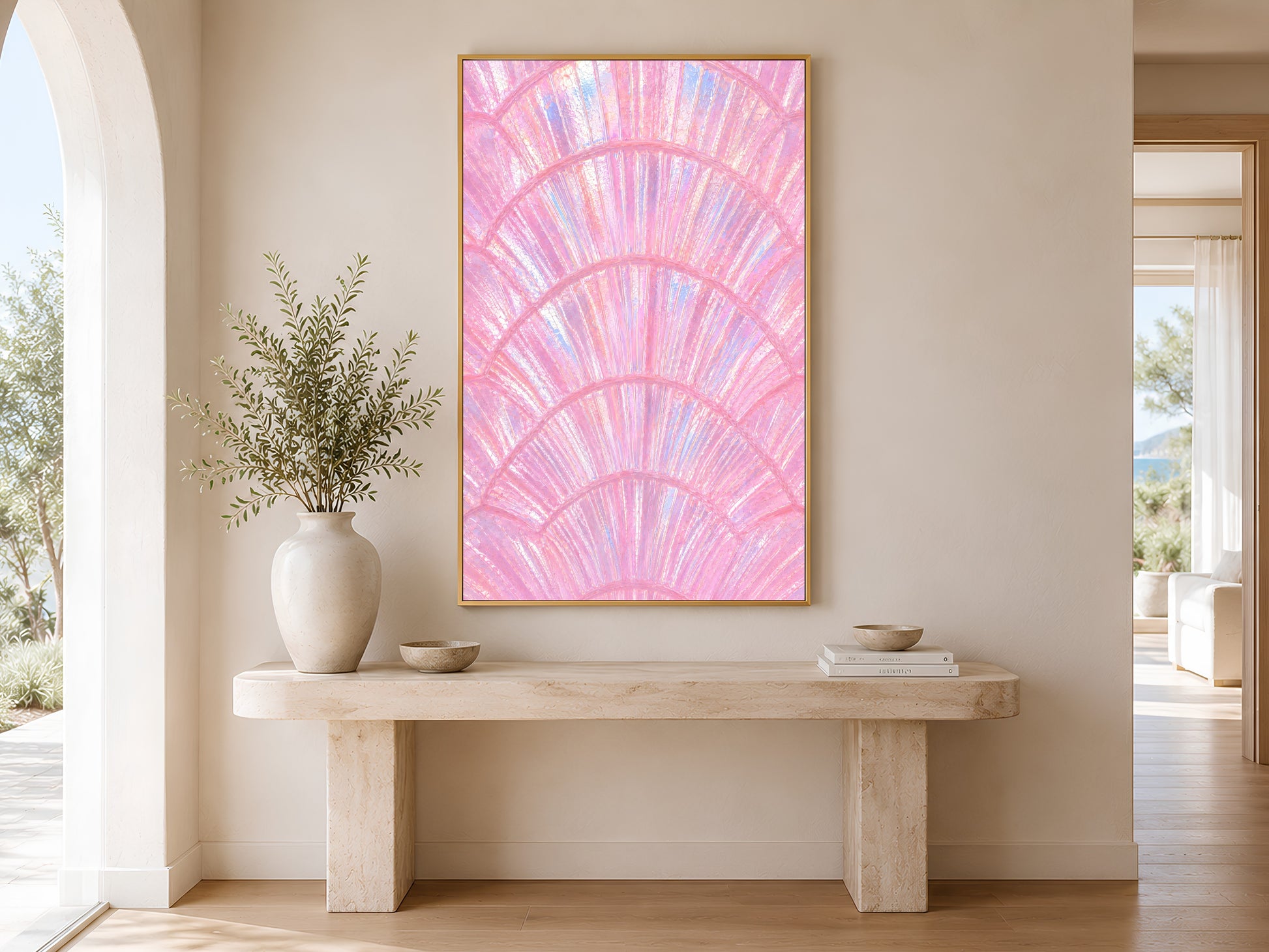 Pink capiz shell wall art in gold frame above a console table in a warm minimal neutral hallway with ceramic vase