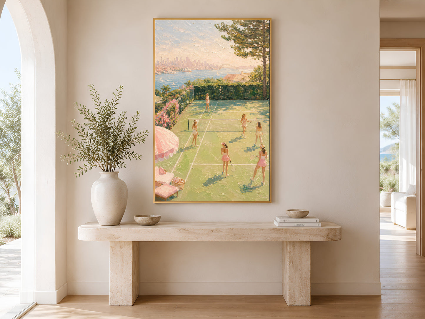 Country club tennis print in gold frame above a marble console table in a minimal bright neutral hallway