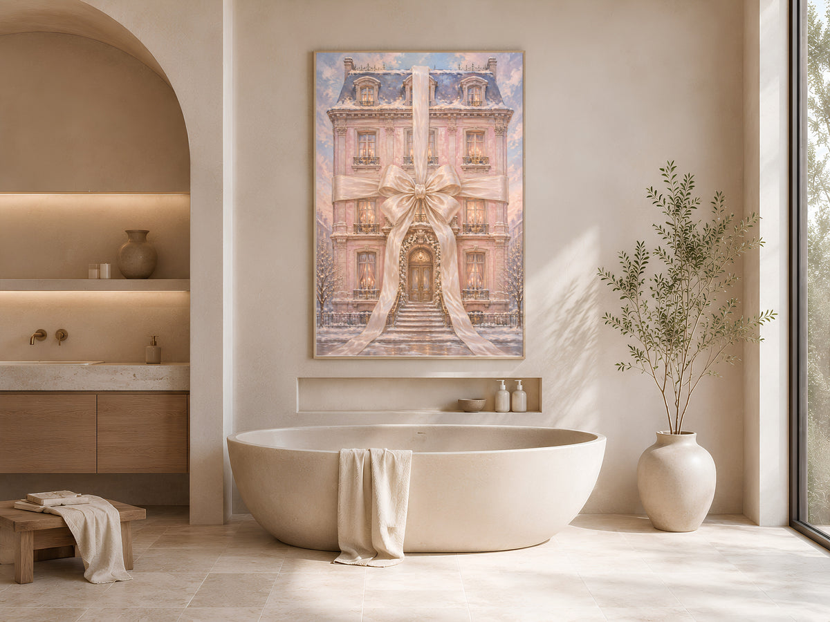 Pink chateau Christmas wall art framed above a freestanding tub in a warm neutral bathroom