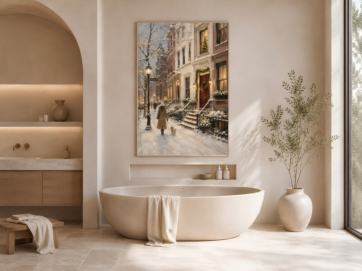 Framed snowy NYC oil painting print displayed above freestanding bathtub in spa-style bathroom
