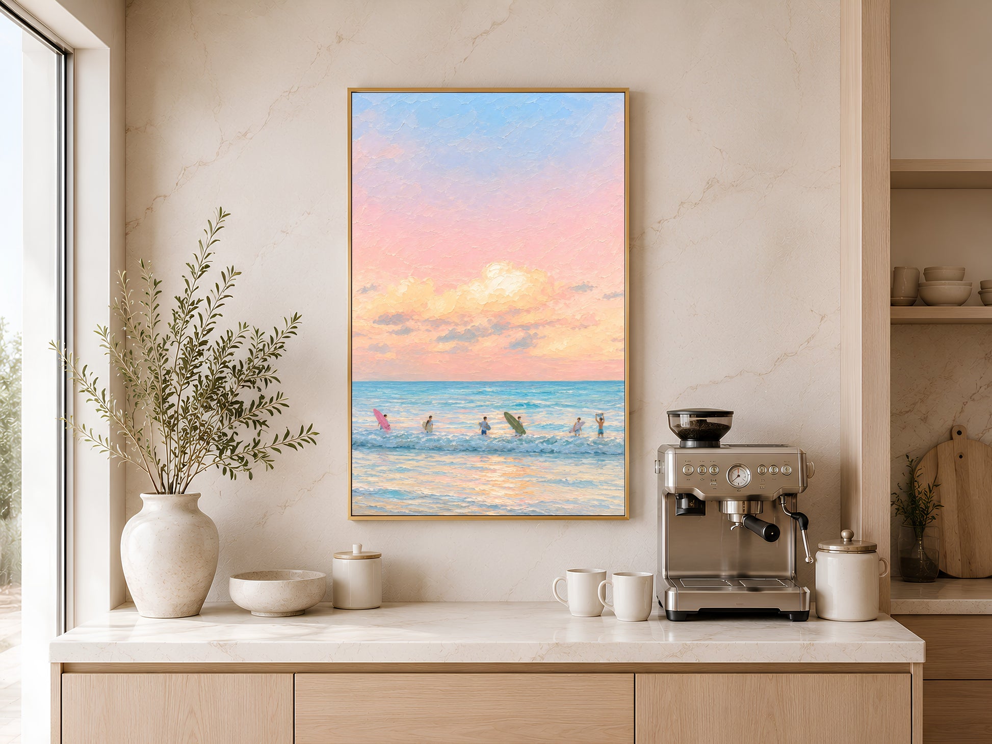 Framed impasto pastel sunset surf print on warm beige wall above console table with coffee maker in minimal kitchen
