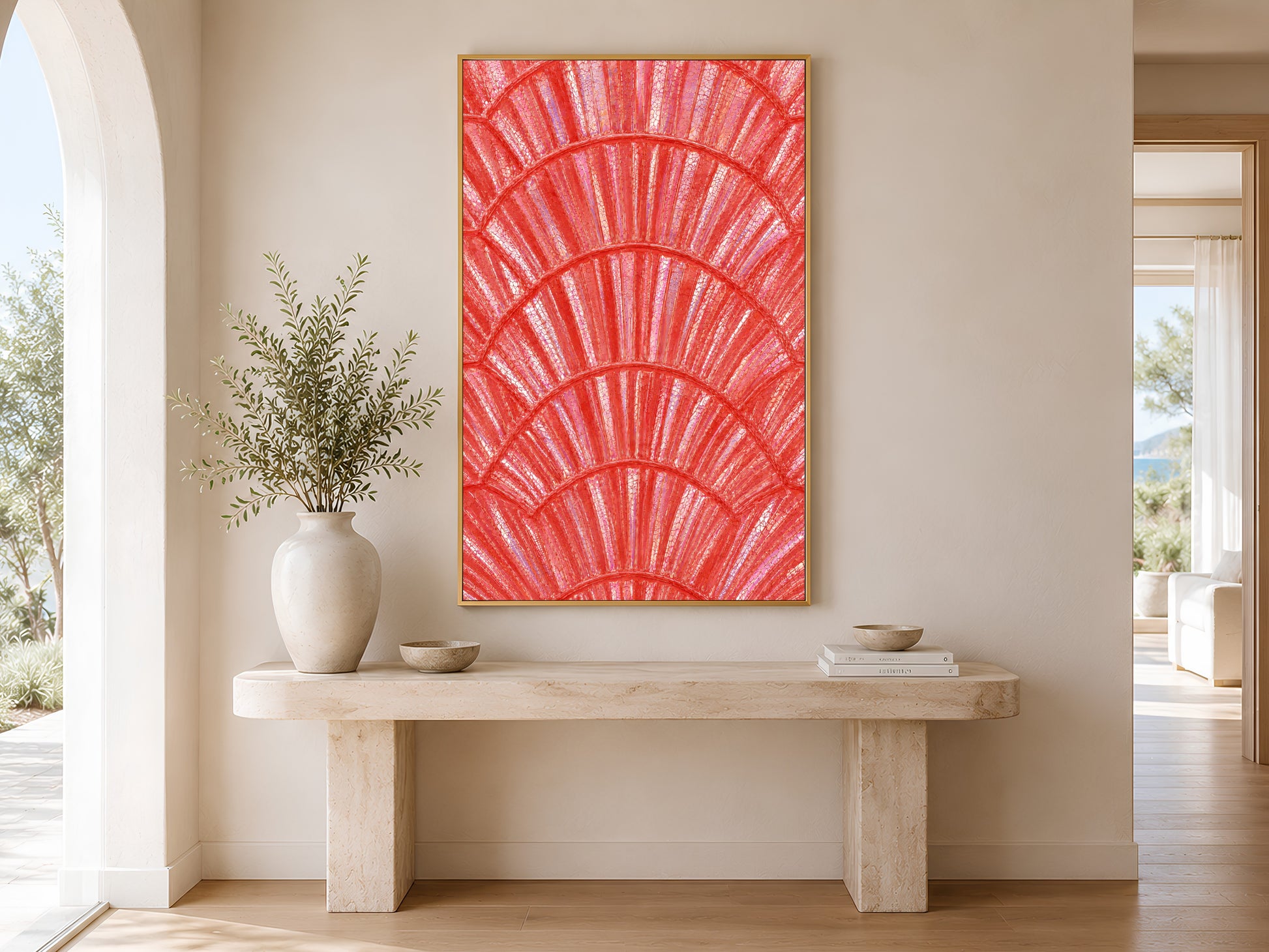 Coral iridescent shell print in gold frame above a console table in a minimal bright neutral hallway with ceramic vase
