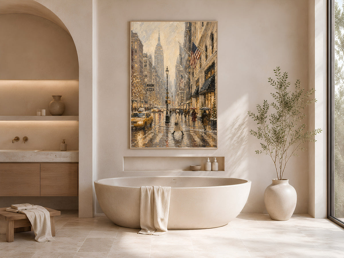 Framed NYC rainy day oil painting print displayed above freestanding bathtub in spa-style bathroom