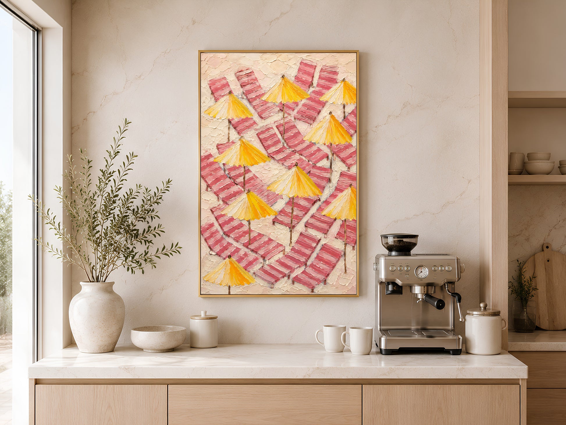 Pink beach umbrella wall art printable hanging above a coffee station in a warm minimalist kitchen with coastal Mediterranean styling.