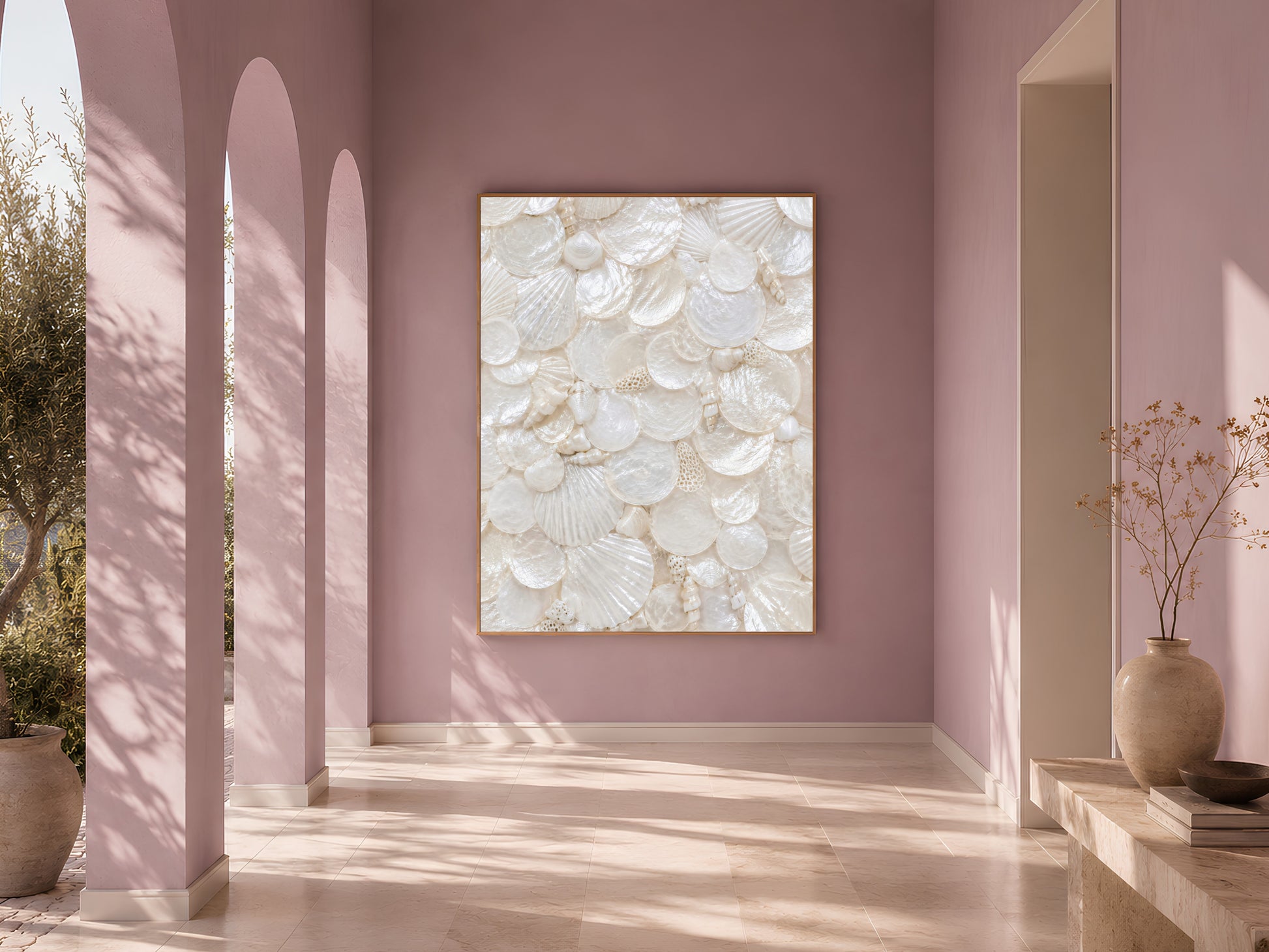 Sunlit arched entryway with mauve walls and a framed iridescent shell print hanging as a statement piece in the hall.